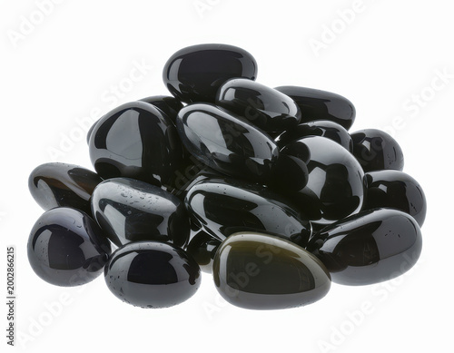 A large pile of polished black pebbles isolated on a white background, for decorative garden use