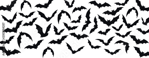 Black bat silhouettes flying in various poses against a white background bats night