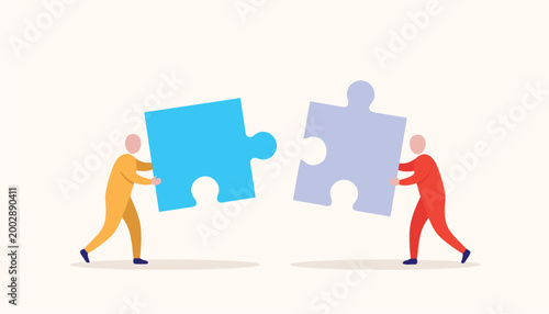 Two people connecting two large jigsaw puzzle pieces together, symbolizing teamwork, partnership, and problem-solving in business.