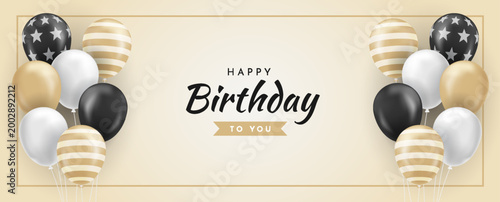 Elegant and festive horizontal banner design featuring a cluster of assorted balloons in black white and gold with stars and stripes patterns accompanying the text Happy Birthday To You