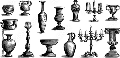 Collection of engraved vases and candle holders on white background