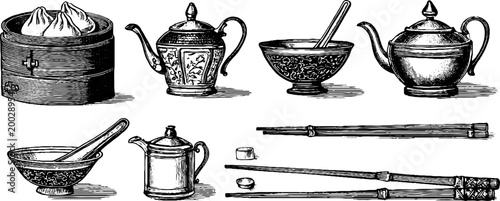 Chinese teaware and dim sum arranged on wooden table