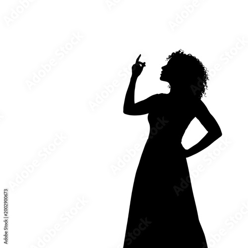 Silhouette of a woman in a dress pointing upwards with her finger