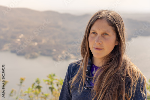 Konstfotografi Young Woman Portrait with Lake Background