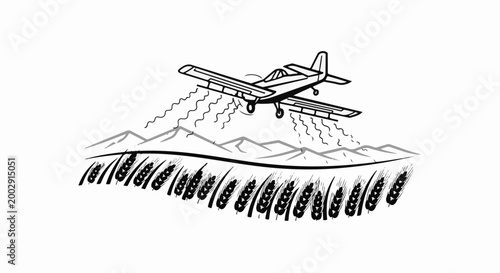 Small plane spraying crops over a field of wheat and mountains