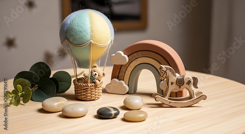 Wooden toys displayed on a table hot air balloon rainbow and rocking horse