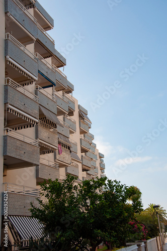 Modern building with balcony. Residential building architecture. Architectural building. Residential touristic district. Hotel in Spain, Salou. Summer vacation. Residential architectural district