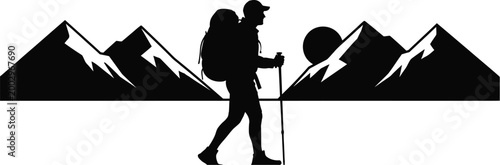 Silhouette of hiker with backpack walking in mountainous landscape
