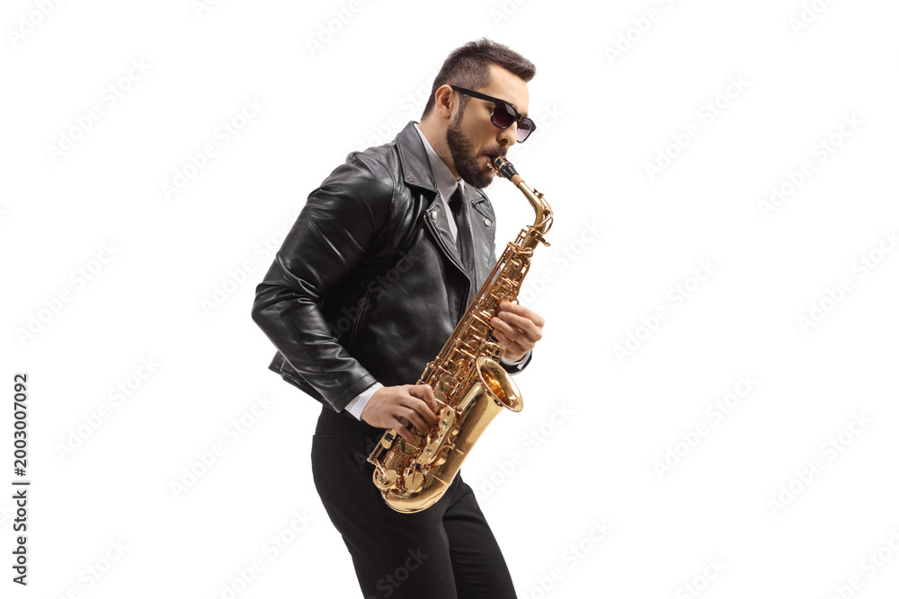 Fototapeta premium Man in a leather jacket playing a saxophone
