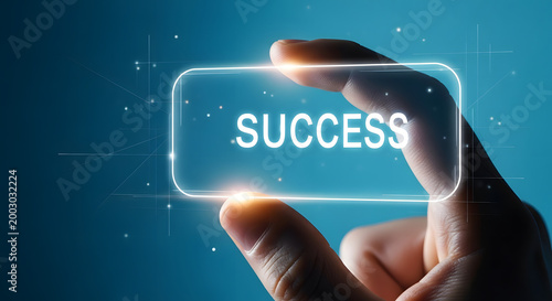 Hand holding glowing rectangle displaying word success against dark blue.