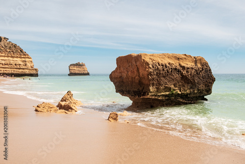 Rocks, beach and ocean at Praia da Marinha - Portugal