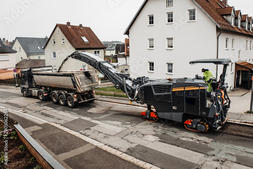 Cuadro en lienzo Road Milling Machine Removing Asphalt Surface for Urban Street Reconstruction an