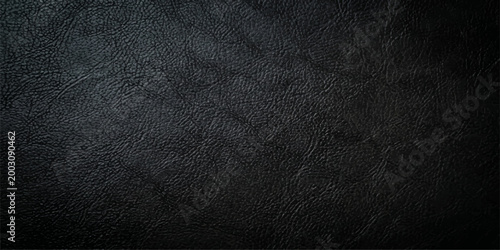 Elegant black leather texture reveals subtle intricacies and luxurious feel, a perfect backdrop for product presentations and design projects.
