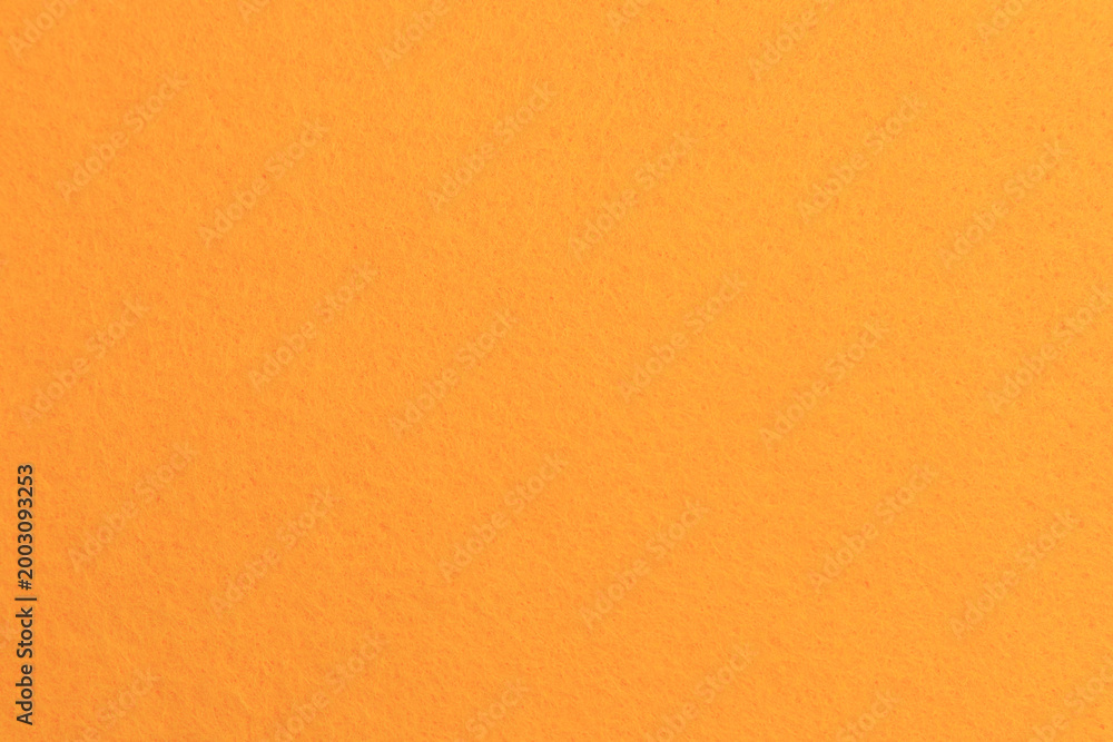 Naklejka premium Bright orange background with texture for various creative projects and designs in different lighting conditions