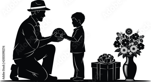 Father's Day silhouette of dad giving a soccer ball to his son.