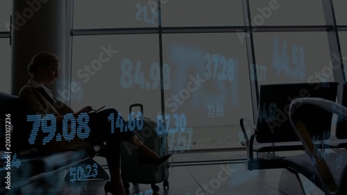 Woman tapping tablet at gate and generating finance numbers drifting across front tracking stocks