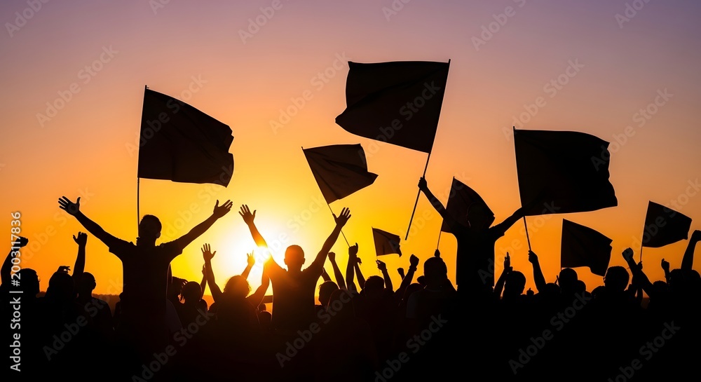 Naklejka premium Crowd with flags celebrating at sunset, silhouette against warm sky