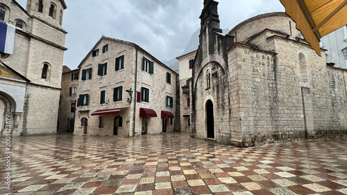 Konstfotografi Trg od Oružja in Kotor with Saint Tryphon Cathedral and St Luke Church in rain
