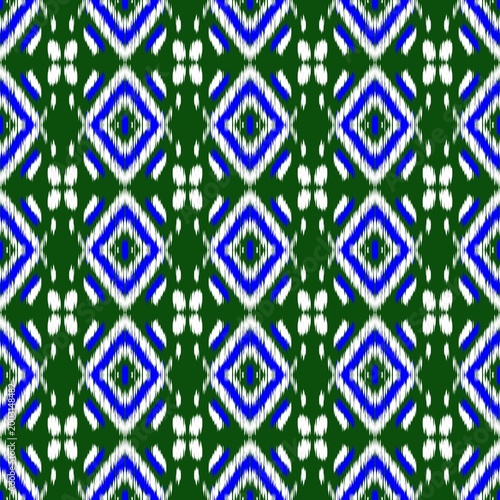 Geometric Diamond Shapes in Blue and White on Green Background