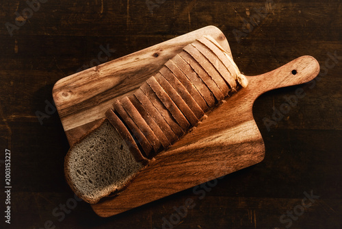 Whole wheat  bread on wooden background