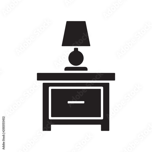 Flat black vector icon of a bedside table with a lamp isolated on white background