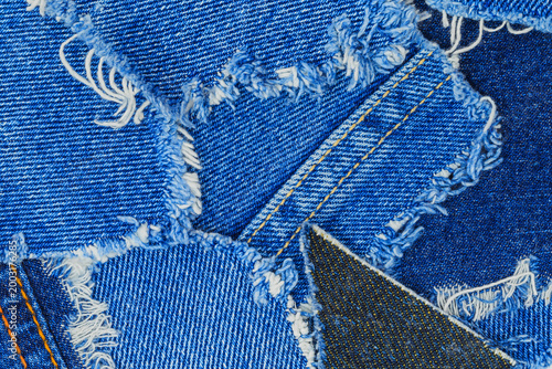 Konstfotografi Denim fabric pieces showing different textures and colors arranged on a surface