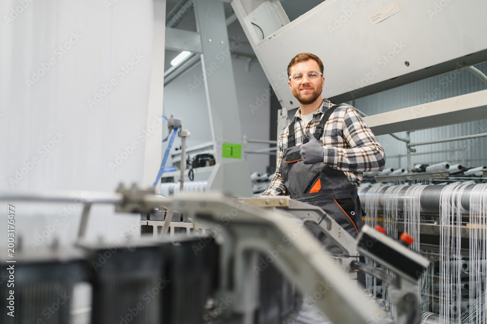 Fototapeta premium Factory worker showing thumbs up during polypropylene production
