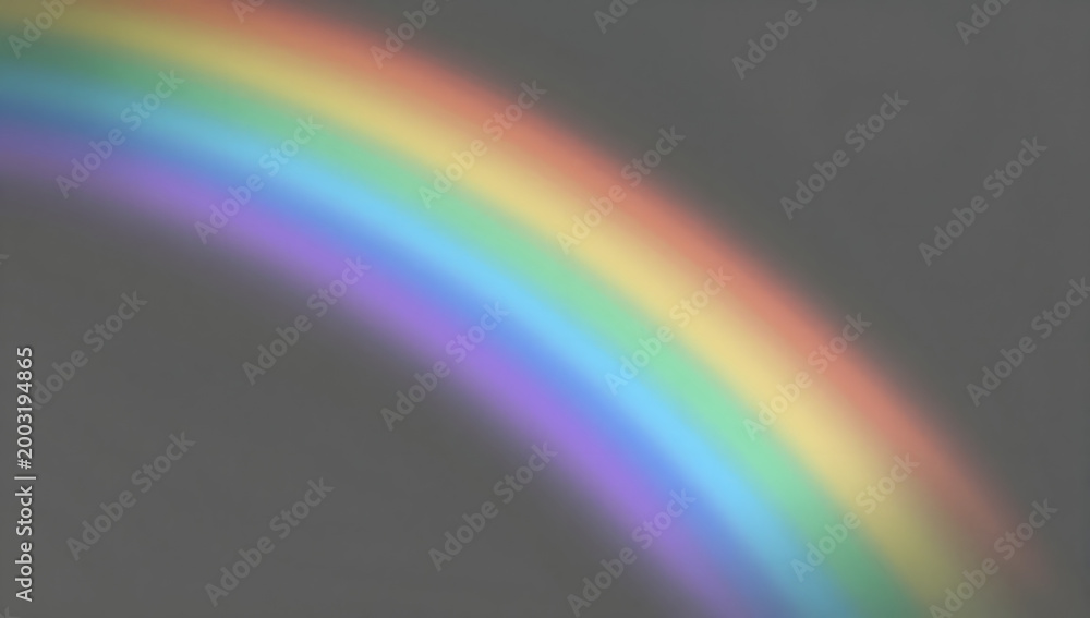 Naklejka premium Arc of Serenity: A vivid rainbow, a symbol of hope and promise, gracefully arches across the soft sky. This image evokes feelings of tranquility and the beauty of nature.