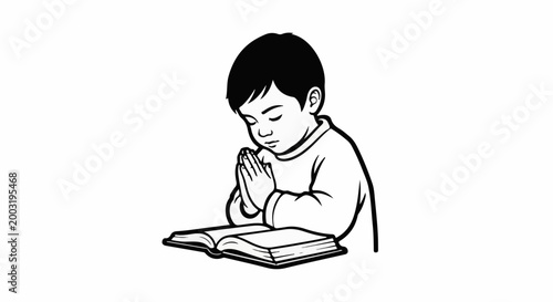 Young child with eyes closed clasped hands over open book
