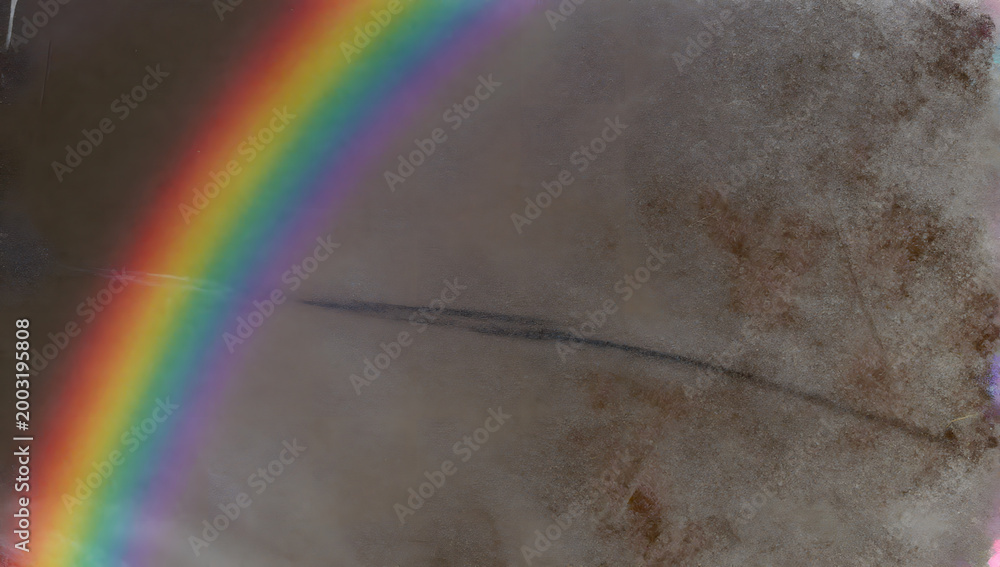 Obraz premium Rainbow over Dust Storm: A vibrant rainbow arcs gracefully across a swirling dust storm, painting a scene of natural wonder and resilience in the face of adversity. 