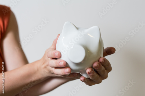 Person holding a white pigg...