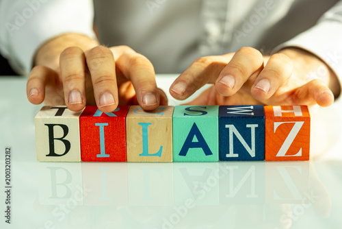 Hands arrange alphabet bloc...