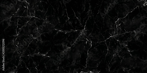 Abstract black and white paper texture with a dark grunge marble pattern and aged vintage surface design on an old cracked wall backdrop