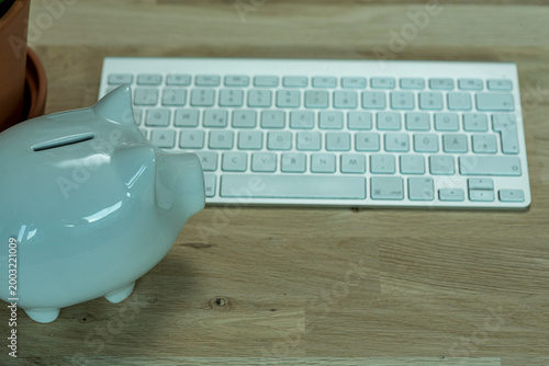 A piggy bank sits next to a...