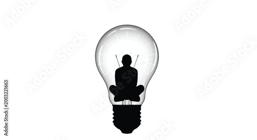 Silhouette of a person meditating inside a glowing light bulb representing inspiration and ideas