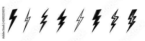 Lightning bolt symbol set. Collection of hand drawn electric flash shapes with dynamic angles and rough sketch texture
