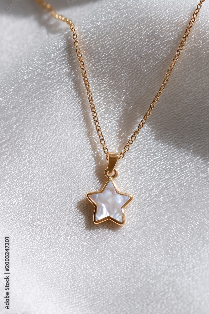 Fototapeta premium Star Pendant Necklace: A delicate and stylish gold chain necklace, featuring a charming star-shaped pendant adorned with iridescent, mother-of-pearl, resting on a soft, textured fabric.