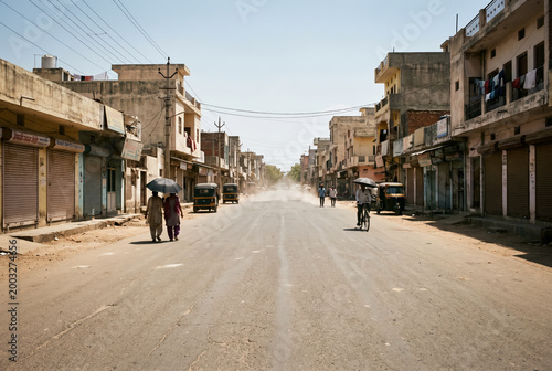 Empty dusty road in Indian city during summer heatwave