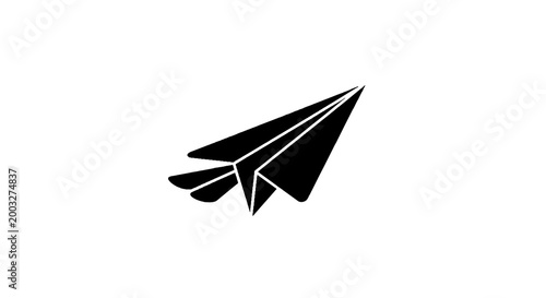 Black paper airplane flying solo.