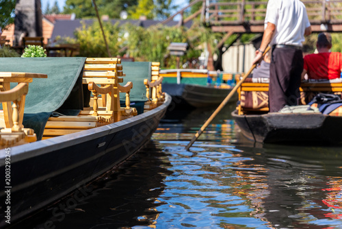 Canvastavla Traditional wooden boat Spreewald canal benches guide paddling long oar tourist relax calm water