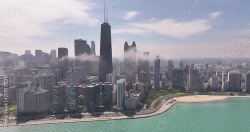 Aerial View of Chicago Skyline with Low Clouds Wrapping Skyscrapers Along Lake Shore Drive on April 26 2026