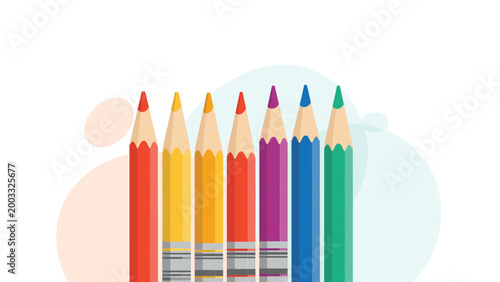Group of colorful pencils of different heights arranged vertically against an abstract background for creative art and school supplies.