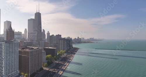  Aerial View of Chicago Skyline Along Lake Shore Drive with Heavy Urban Traffic and Lake Michigan” on April 26 2026 
