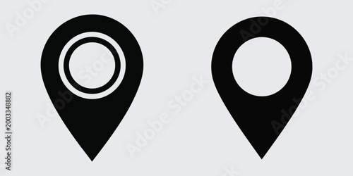 Two black map pin icons with white outlines on a light gray background