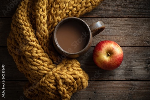 Cozy Autumn Still Life: Coffee, Apple, and Mustard Knit Scarf on Wood