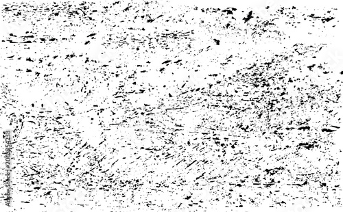 Black splatters and specks on a create abstract pattern