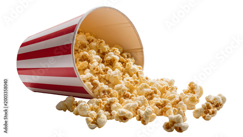 Canvastavla Isolated striped paper cup spilling tasty golden popcorn kernels, traditional mo