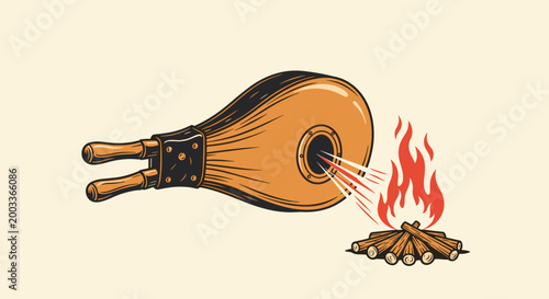 Vintage wooden bellows blowing air to stoke a small crackling campfire, illustrating outdoor camping skills, fire making, and heat energy.