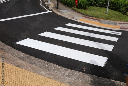Pedestrian crossing crosswalk in Singapore City. Transportation infrastructure.