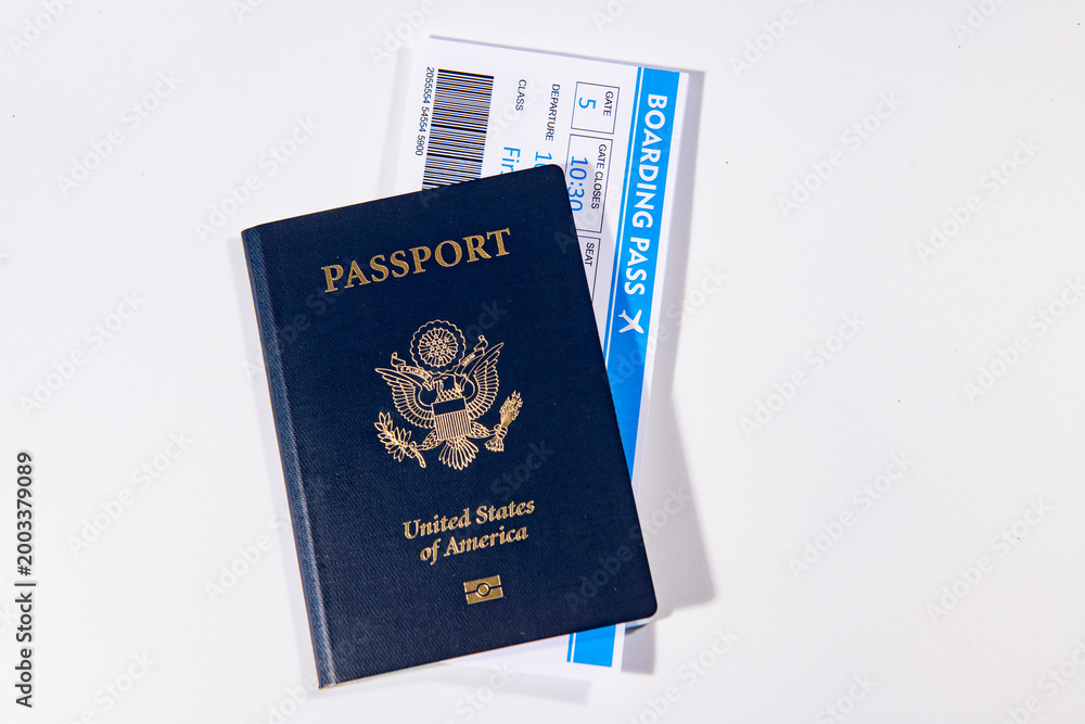 Fototapeta premium US passport with boarding pass for travel. Travel documents for international trip. Airport check in concept. American passport and airline tickets. Vacation and travel theme.